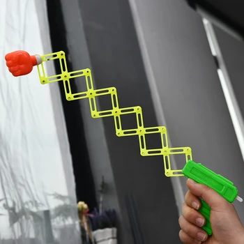 Geri çekilebilir Yumruk Atıcı Trick Oyuncak Tabanca Komik Çocuk Çocuklar Plastik Parti Festivali Hediye Eğlenceli Klasik Elastik Teleskopik Yumruk Oyuncaklar 0