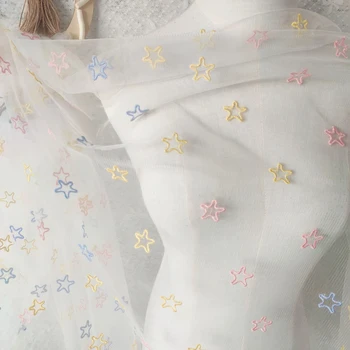 Beyaz iplik renkli beş köşeli yıldız işlemeli dantel kumaş pembe mavi ve sarı işlemeli yıldız etek kumaş